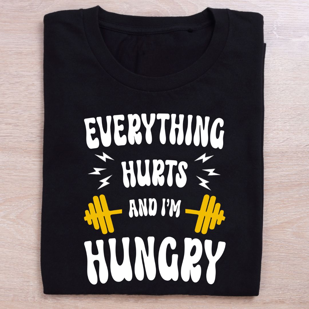 folded black gym t shirt everything hurts am hungry