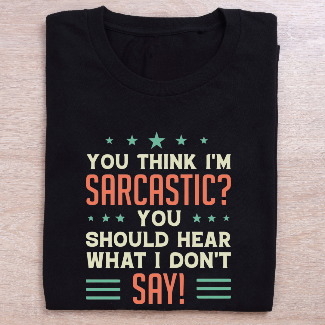 folded black quirky t shirt hear what is unsaid