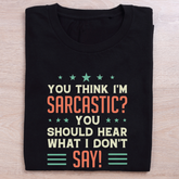 folded black quirky t shirt hear what is unsaid