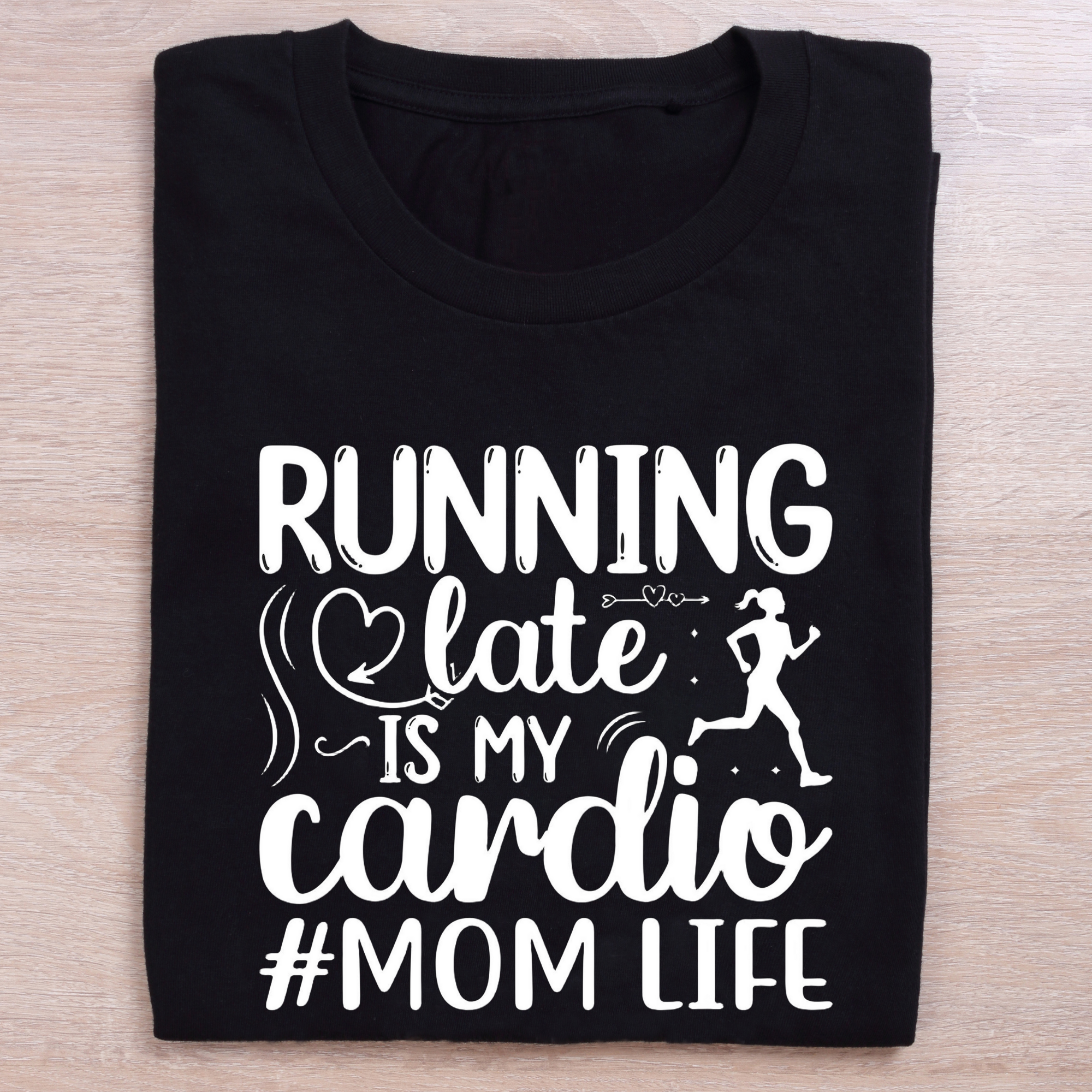 folded black running t shirt mom life