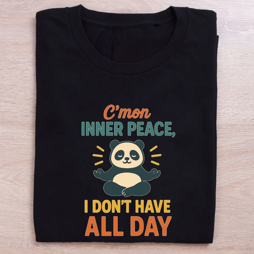 folded black yoga t shirt inner peace