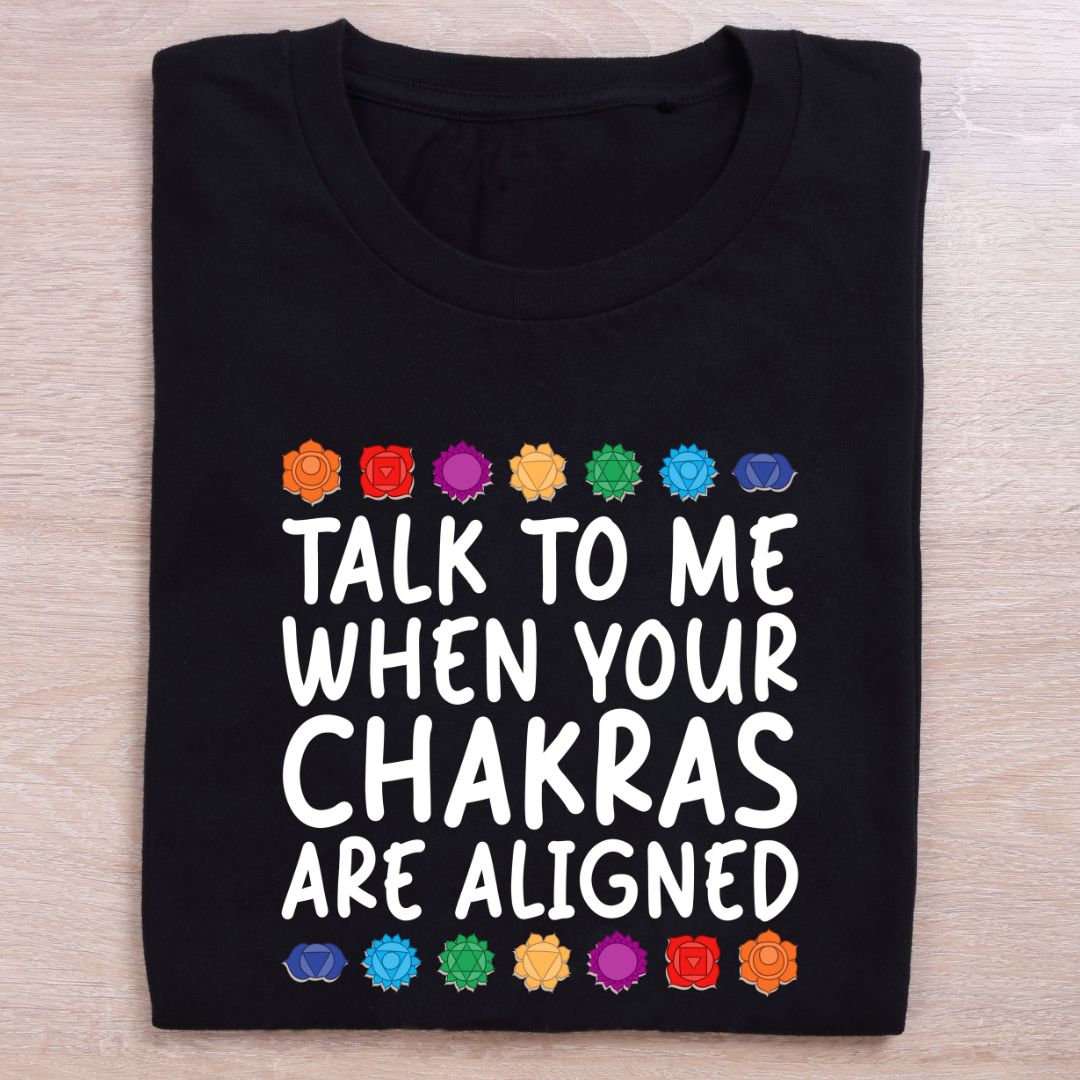 folded black yoga t shirt chakras are aligned